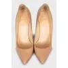 Patent leather shoes made of beige leather