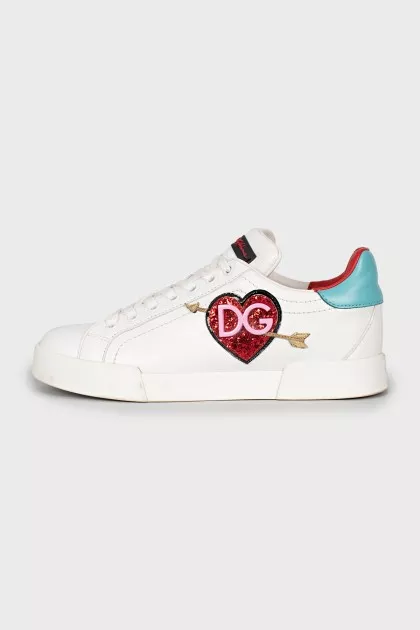 Leather sneakers decorated with a patch