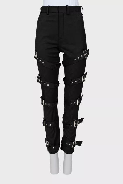 Tapered trousers decorated with straps