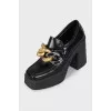 Leather ankle boots with chunky chain