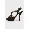 Green sandals with a figured heel