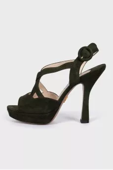 Green sandals with a figured heel