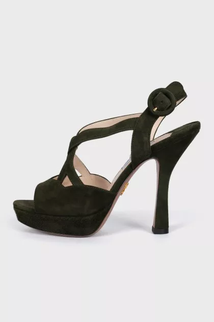 Green sandals with a figured heel