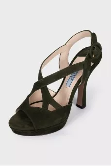 Green sandals with a figured heel