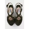 Green sandals with a figured heel