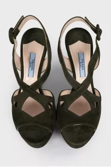 Green sandals with a figured heel