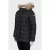 Jacket with a hood decorated with fur