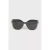 Sunglasses with brand logo on lenses