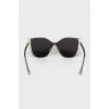 Sunglasses with brand logo on lenses