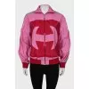 Pink windbreaker with brand logo