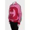 Pink windbreaker with brand logo