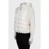 Jacket with knitted sleeves