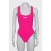 Backless swimsuit with tag