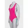 Backless swimsuit with tag