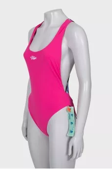 Backless swimsuit with tag