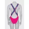 Backless swimsuit with tag