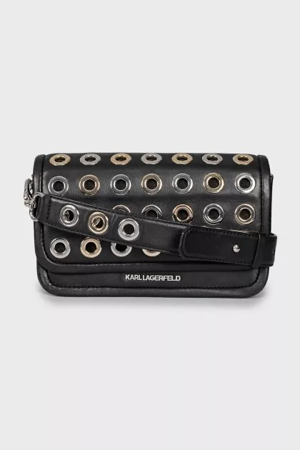 Leather bag decorated with eyelets
