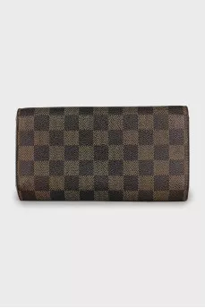 Brown canvas wallet with signature print