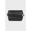 Leather bag with textile strap with tag