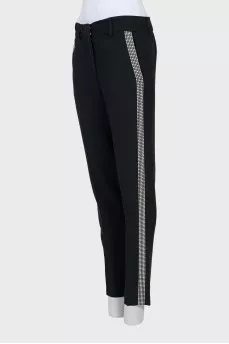 Trousers with silver decor on the side seam