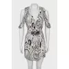 Dress with button fastening
