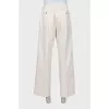 Men's beige trousers with tag