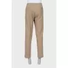 Men's beige trousers with tag