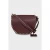 Dark red bag with metallic decor