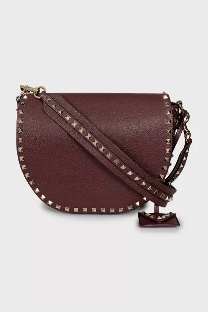 Dark red bag with metallic decor