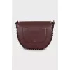 Dark red bag with metallic decor