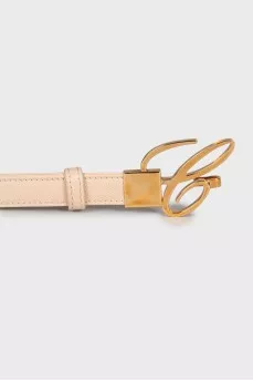 Leather belt with gold buckle