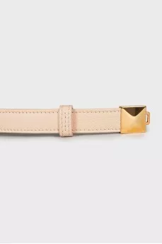 Leather belt with gold buckle
