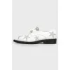 Shoes with embroidery stars with a tag