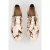 Pearl shoes with a tag