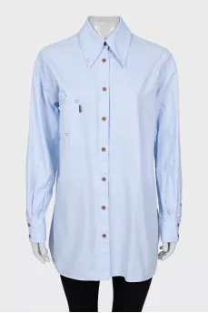 Shirt with asymmetrical pocket