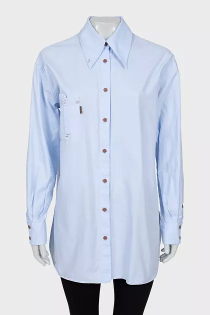 Shirt with asymmetrical pocket