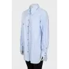Shirt with asymmetrical pocket