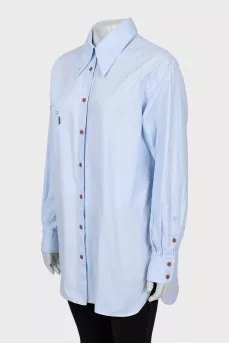 Shirt with asymmetrical pocket