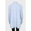 Shirt with asymmetrical pocket