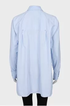 Shirt with asymmetrical pocket
