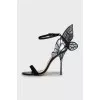 Leather shoes decorated with wings