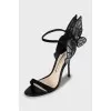 Leather shoes decorated with wings