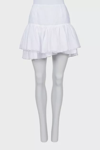 Skirt with rhinestones on the hem with a tag