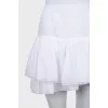 Skirt with rhinestones on the hem with a tag