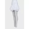 Skirt with rhinestones on the hem with a tag