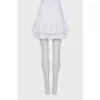 Skirt with rhinestones on the hem with a tag