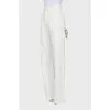White jeans decorated with a rhinestone cord