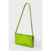 Green neon clutch with tag