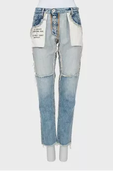 Jeans with inscription on pocket with tag