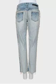Jeans with inscription on pocket with tag